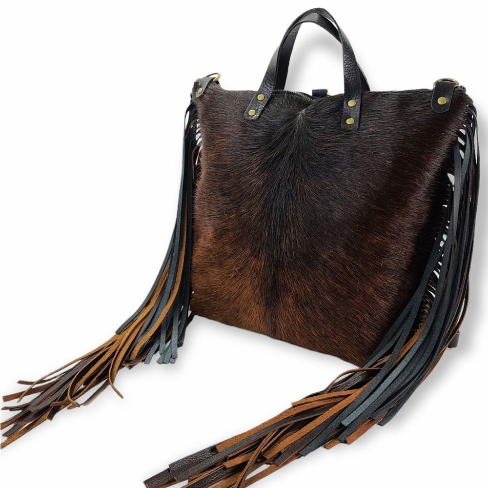 Jill’s Homestead backpack. Black leather back and black to chestnut fade fringe.